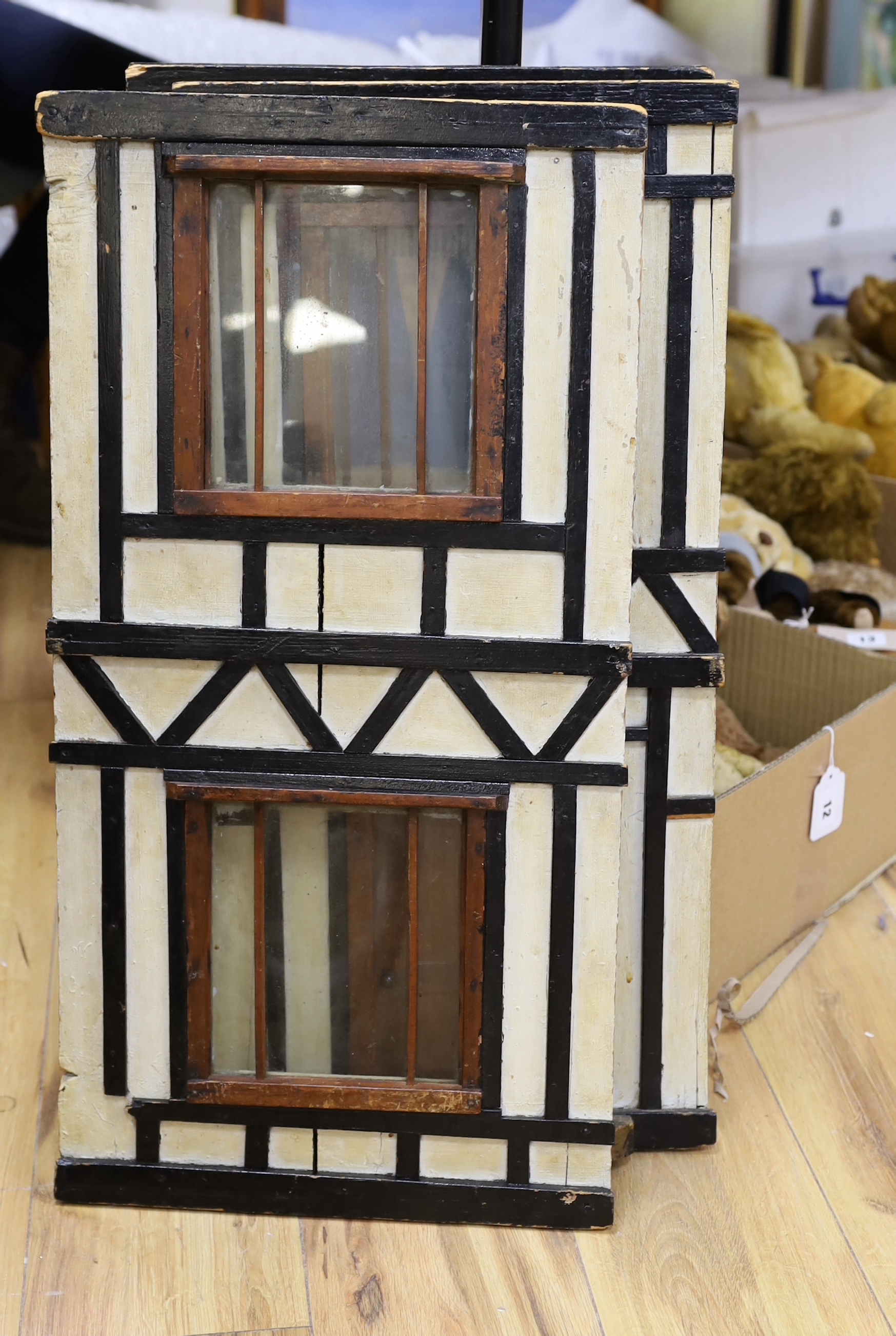 A large furnished English doll's house, circa 1900, presented as William Wordsworth's two floor Tudor-beamed cottage, 119cm x 103cm x 53cm